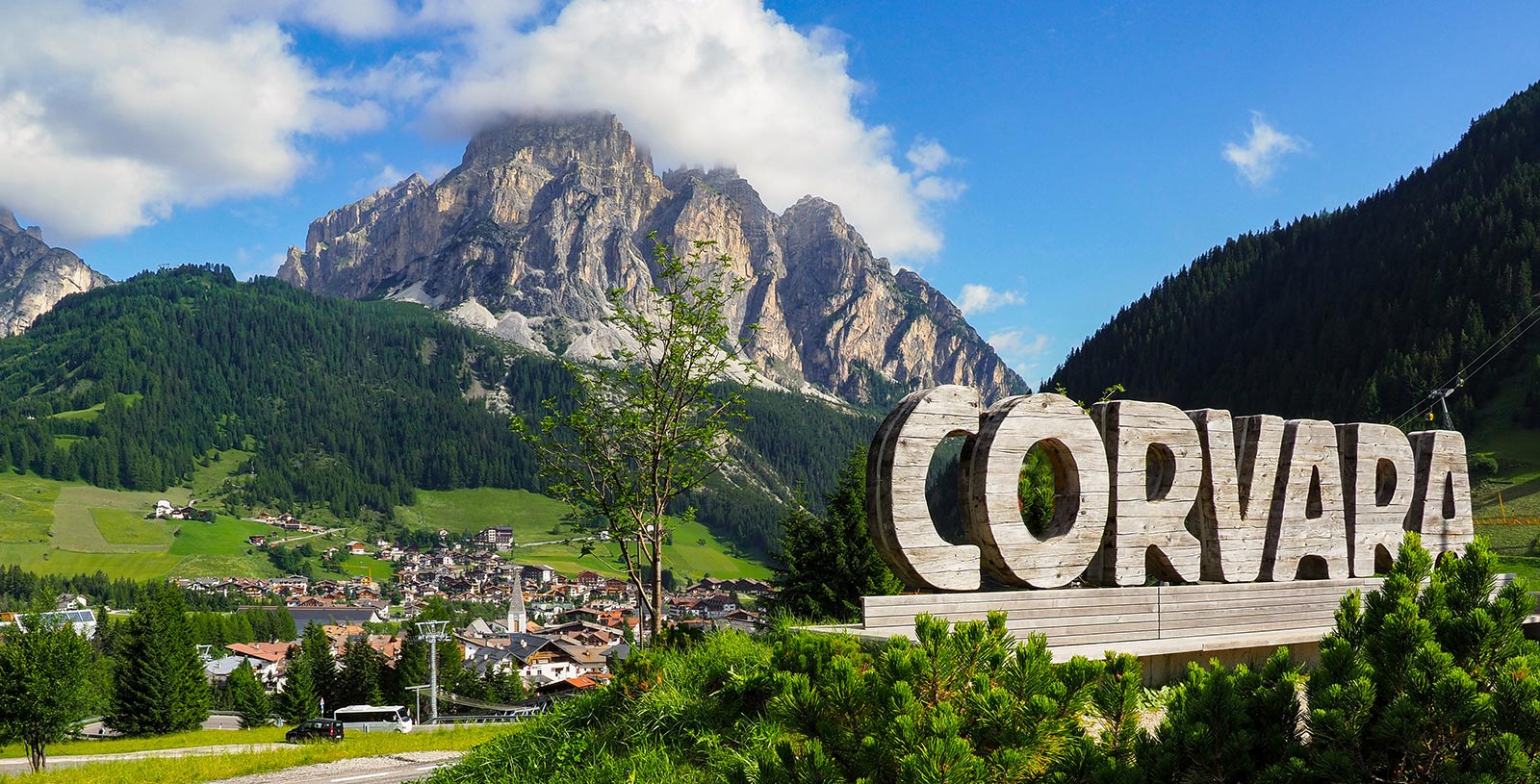 Wooden sculpture at the entrance in Corvara